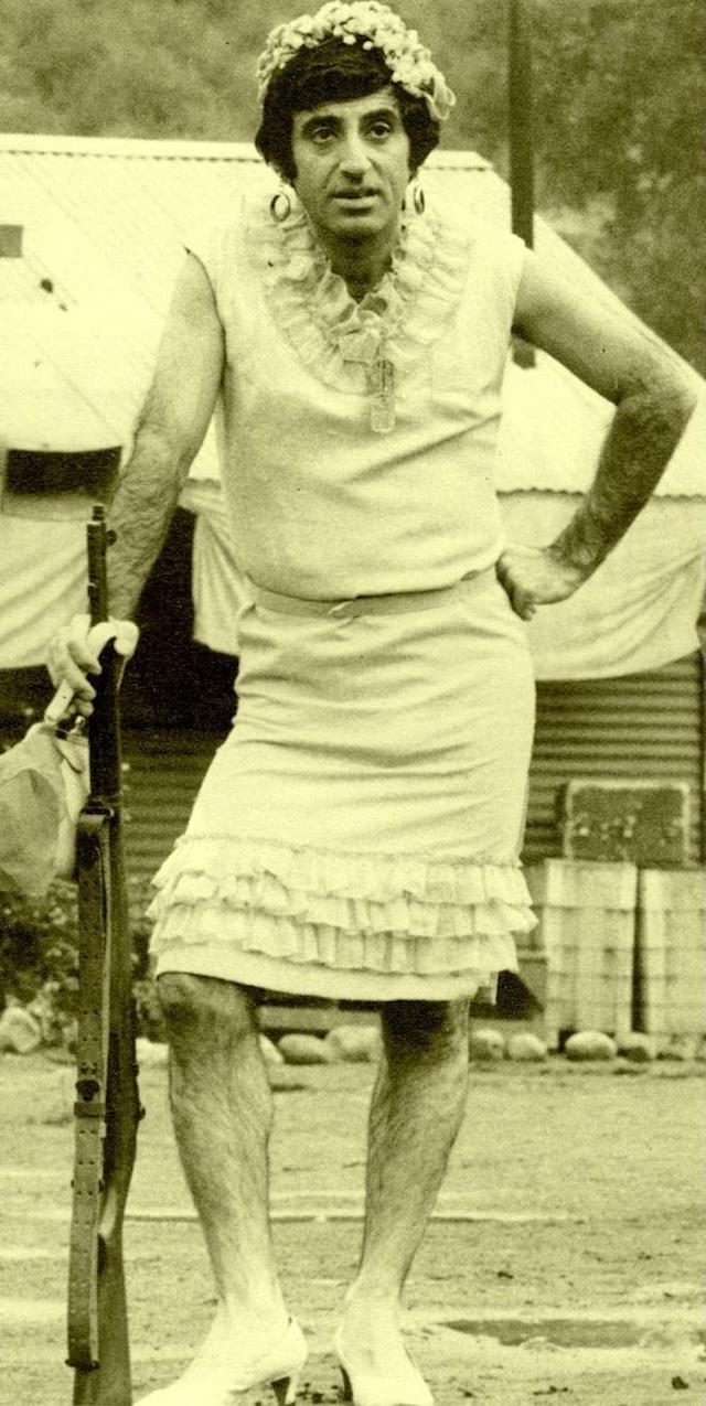 Jamie Farr as Corporal Max Klinger, known for his outlandish efforts to get a Section 8 discharge by wearing women's clothing, here sporting one of his memorable costumes from M*A*S*H