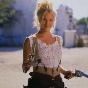 Drew Barrymore as Lilly Laronette, the youngest and most rebellious member of the Bad Girls gang, armed and ready for action.